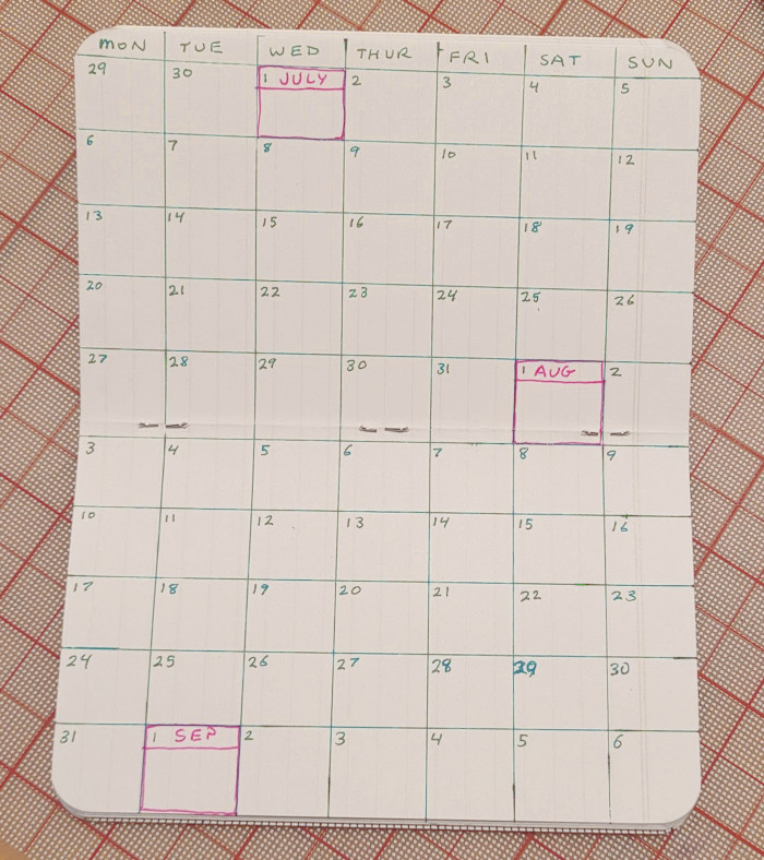 Completed calendar in notebook.